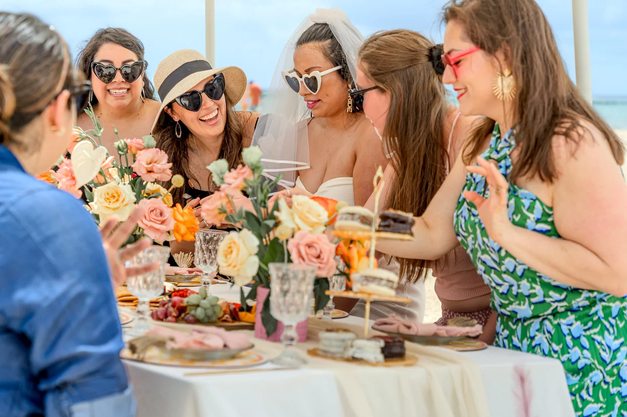 Close-up of bachelorette group enjoying picnic spread