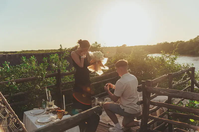 Luxury cenote proposal setup with glowing sign and flower petals