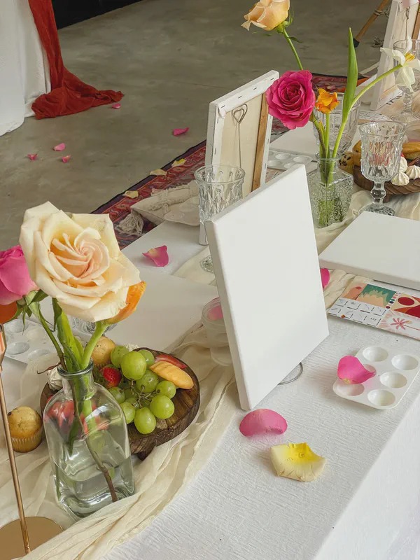 Luxury art supplies and refreshments setup for tropical painting experience