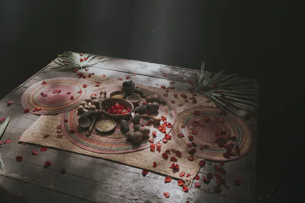 Ancient Mayan wedding ceremony setup in Mexico with traditional offerings, copal incense, and ceremonial elements on woven mat for spiritual vow renewal ritual